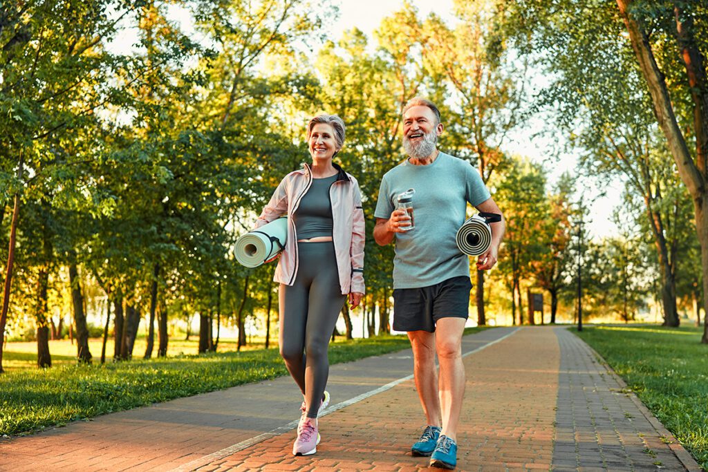 Beautiful sporty healthy active cheerful smiling middle aged couple