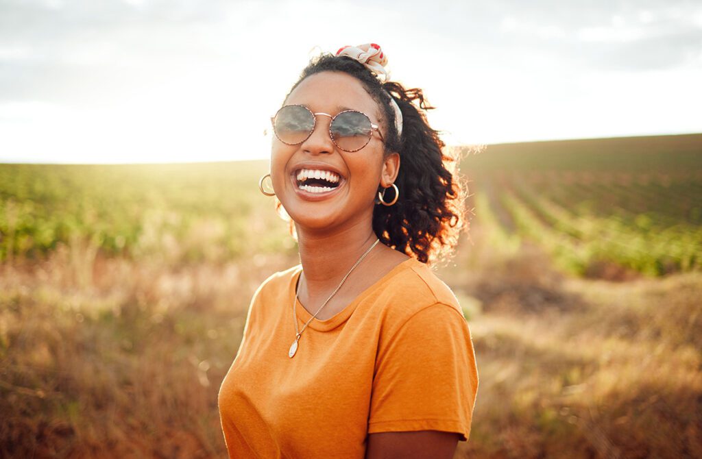 happy women on farm smiling with sun