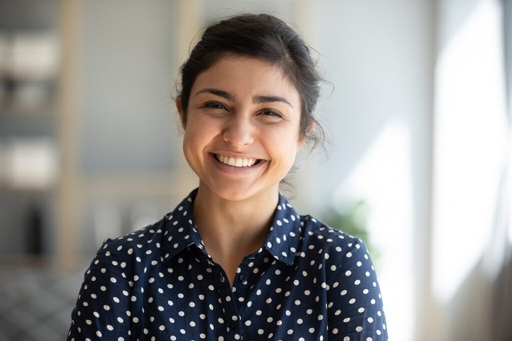 cheerful happy girl looking at camera
