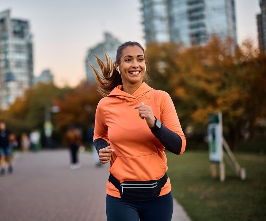 happy women running while listening to music