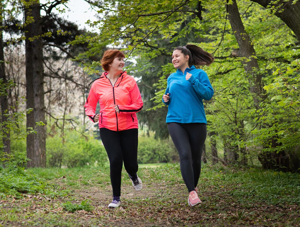 people jogging outside in the woods for exercise