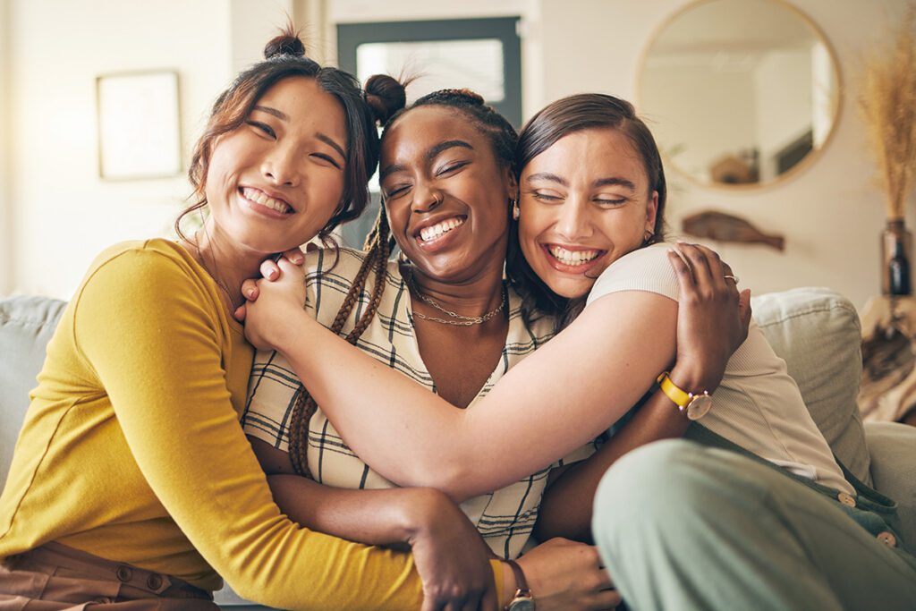 Group of women hugging and smiling