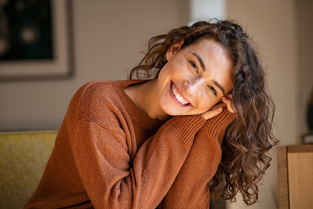 women smiling looking at the camera